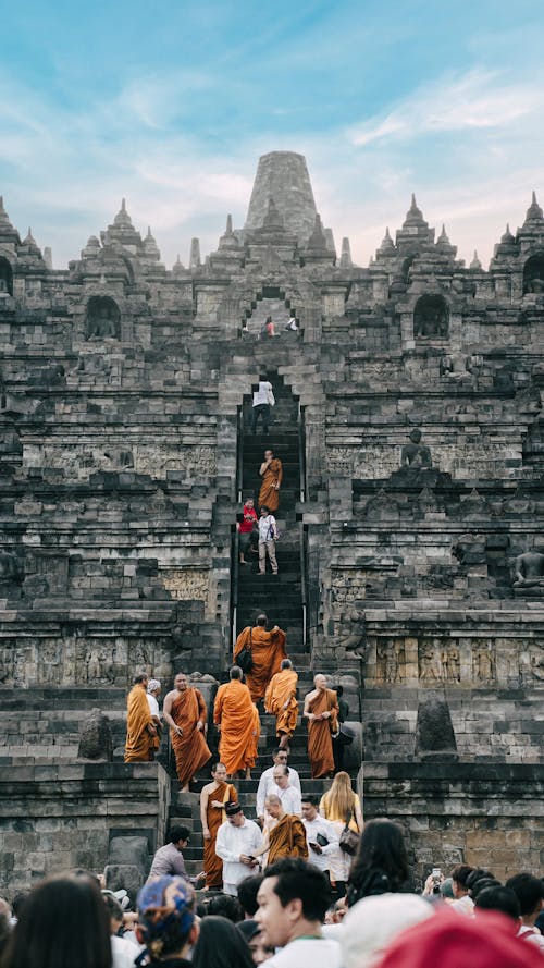 Buddhist monk walking on the Borobudur stairs on vesak day