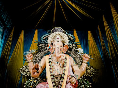 Free Intricately designed Ganesha idol with vibrant colors at a Mumbai temple. Stock Photo