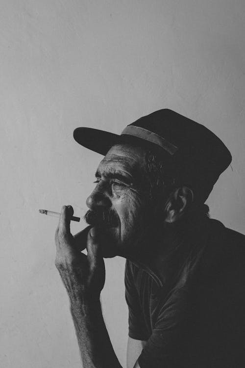Elderly Man Smoking Cigarette