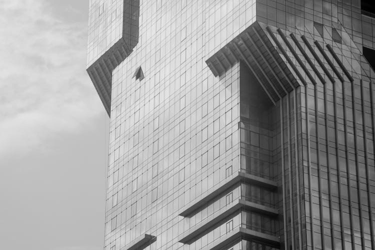 A Black And White Photo Of A Tall Building