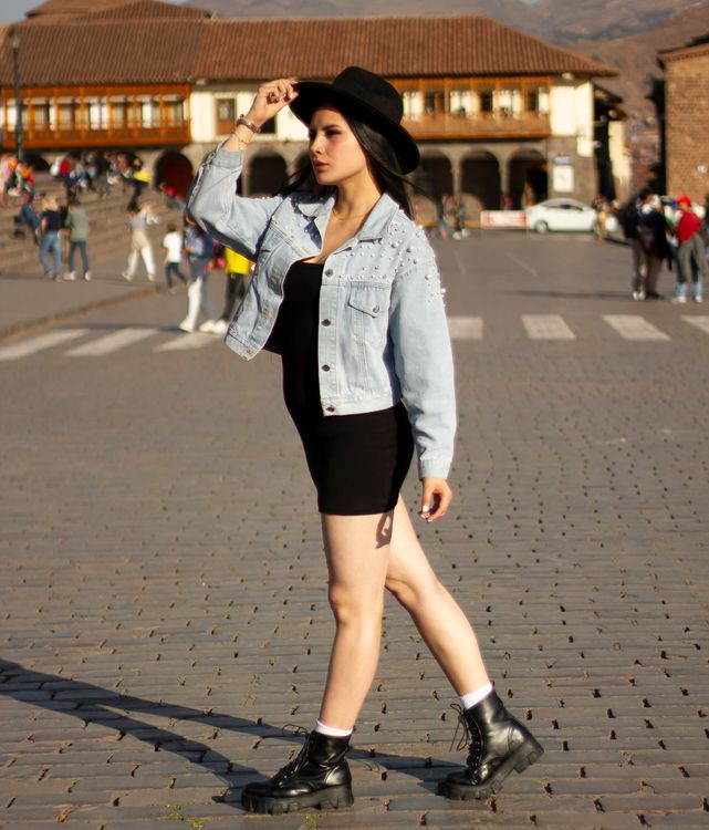 Woman in Mini Dress and Jean Jacket  Free Stock Photo