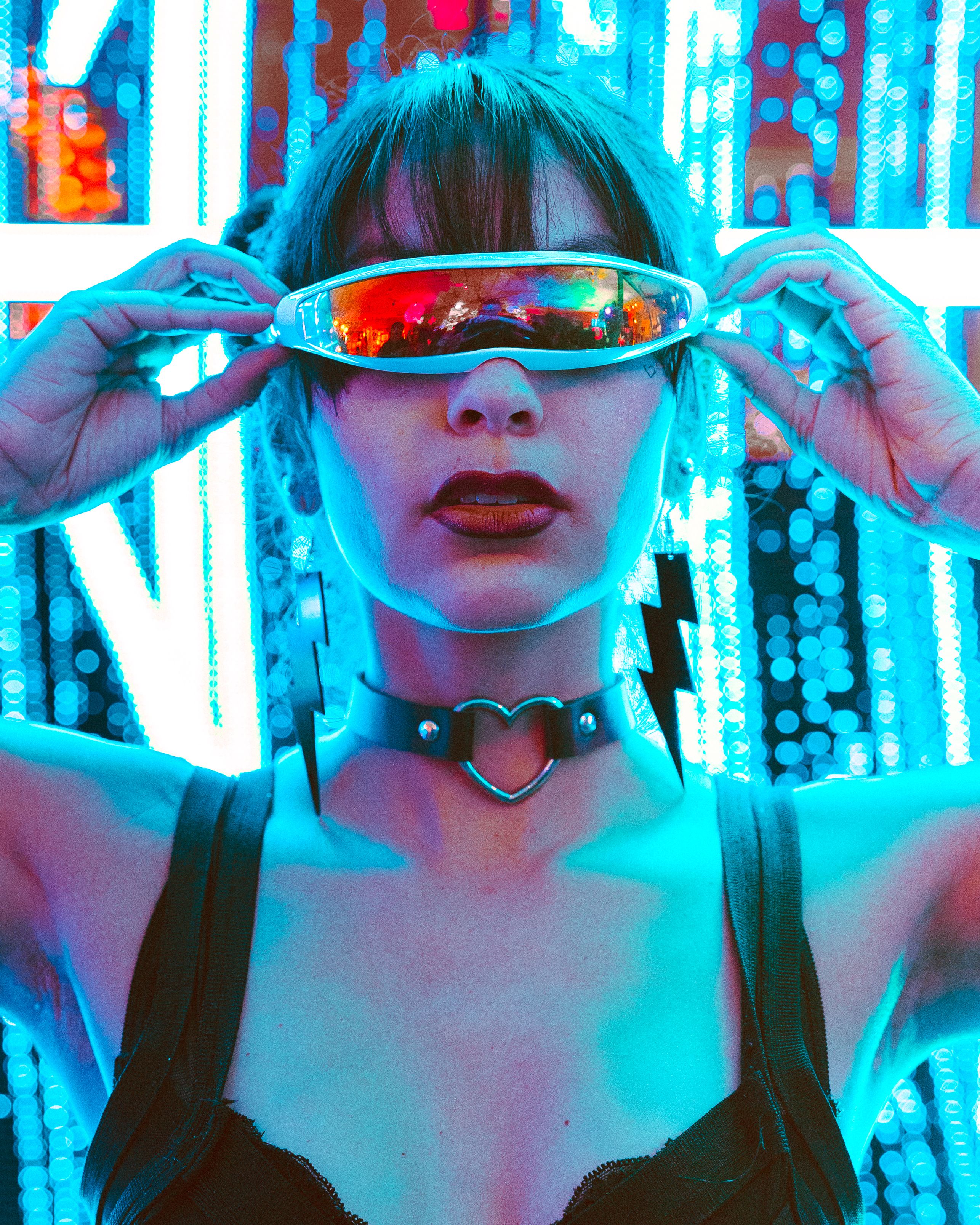 A woman with sunglasses on her head and a necklace · Free Stock Photo