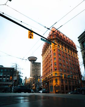 View of a historic building in a bustling city intersection, showcasing urban architecture.