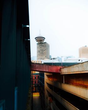 Cityscape featuring a distinctive urban tower against a dynamic skyline.