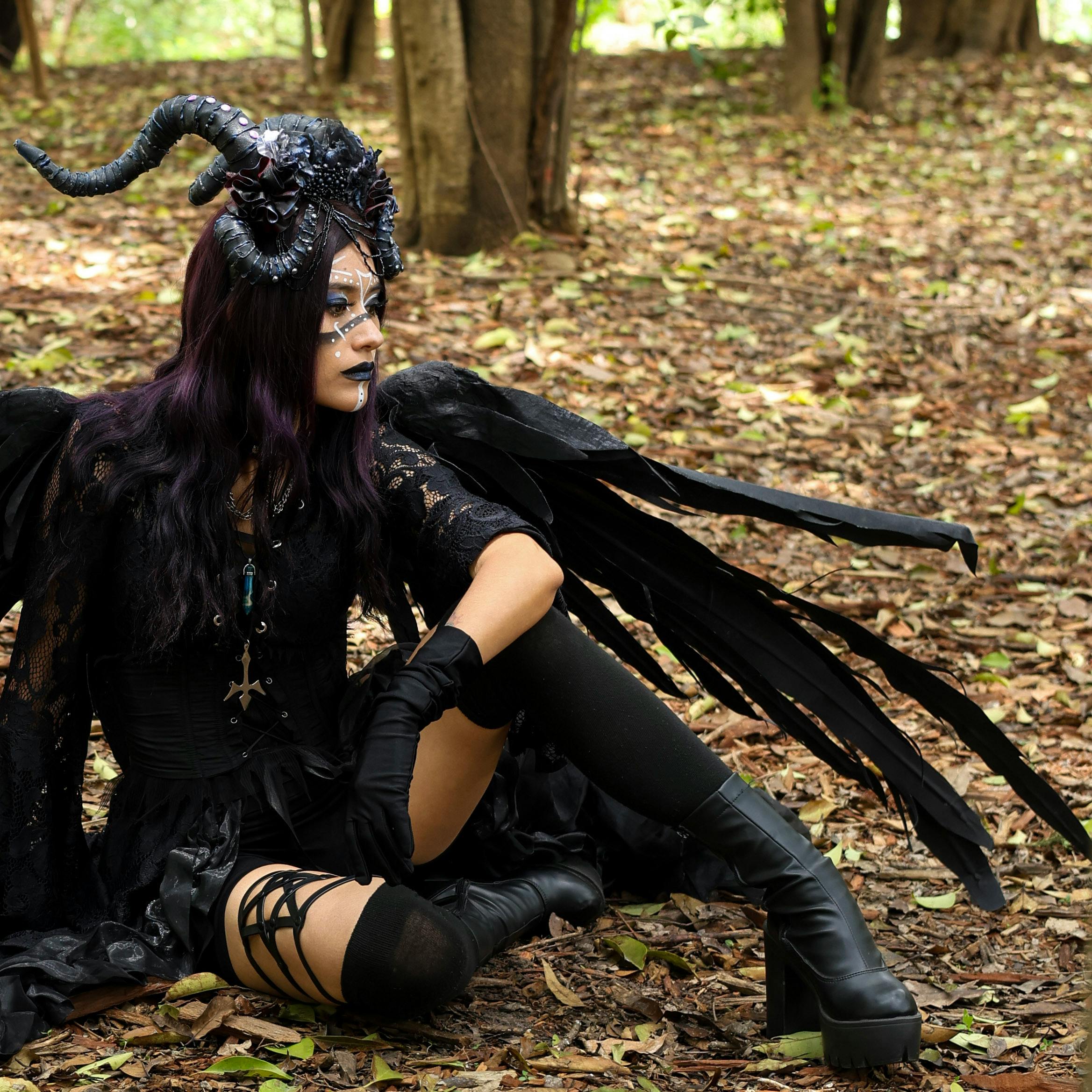 Woman Sitting in Park in Halloween Costume