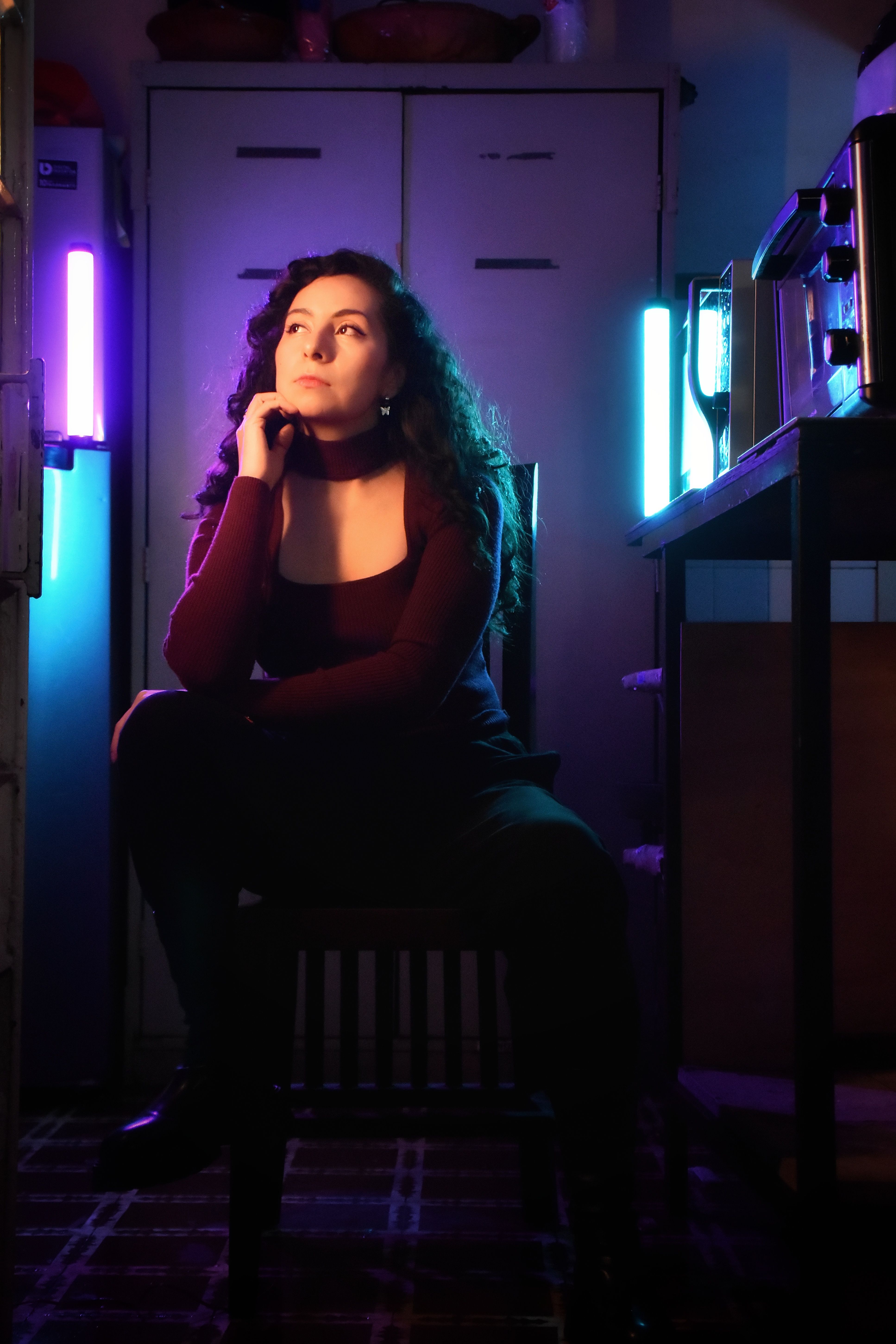 Woman Sitting in Dark Room · Free Stock Photo