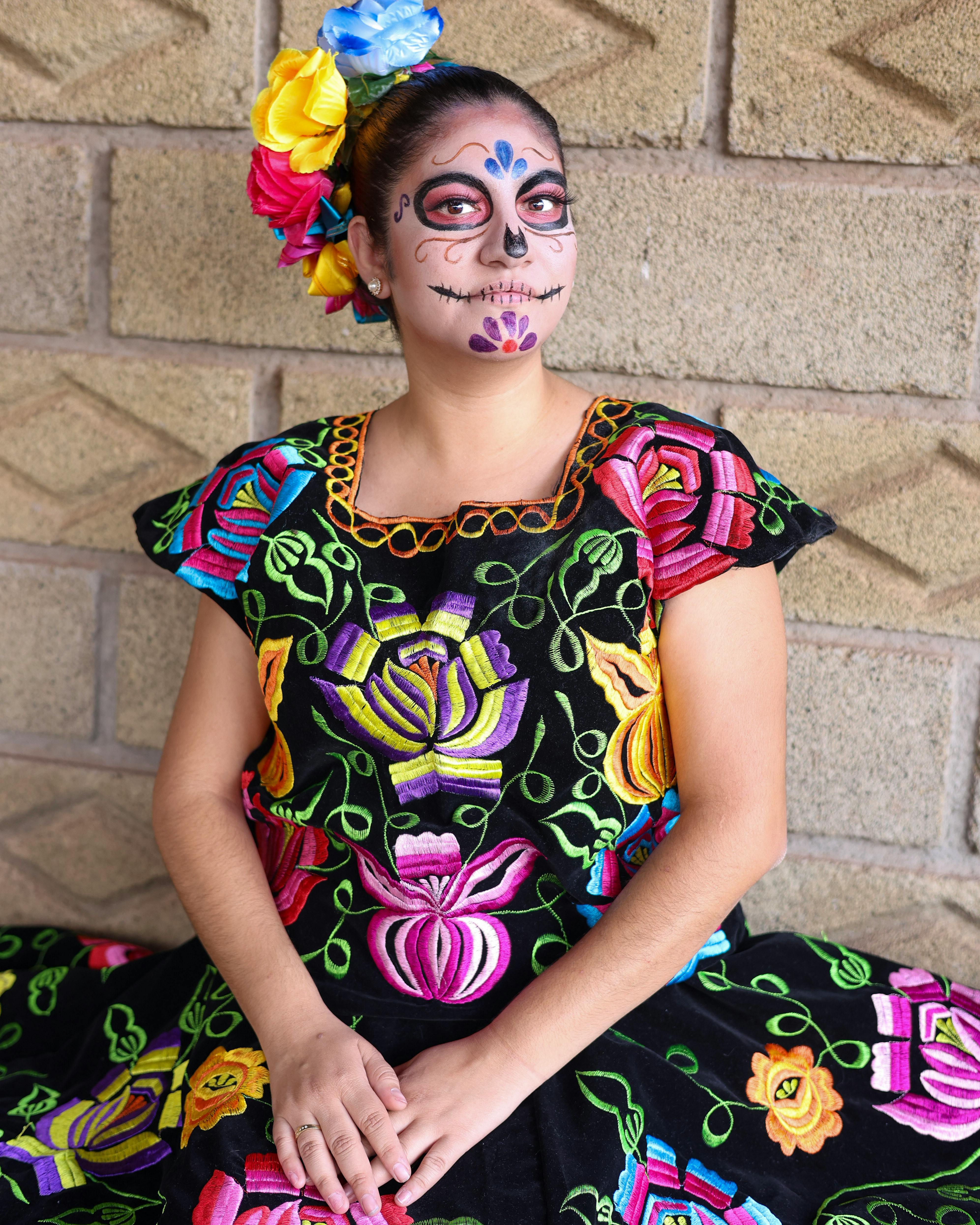 young woman in a traditional mexican costume for the day of the dead