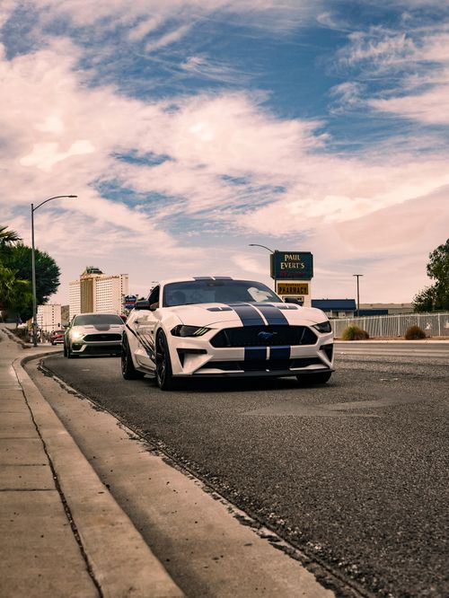 Free Dynamic view of sports cars on an urban road, capturing the essence of speed and style. Stock Photo