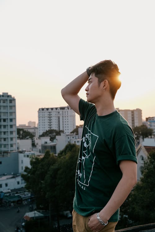 Free Teenager in Tshirt in City at Sunset Stock Photo