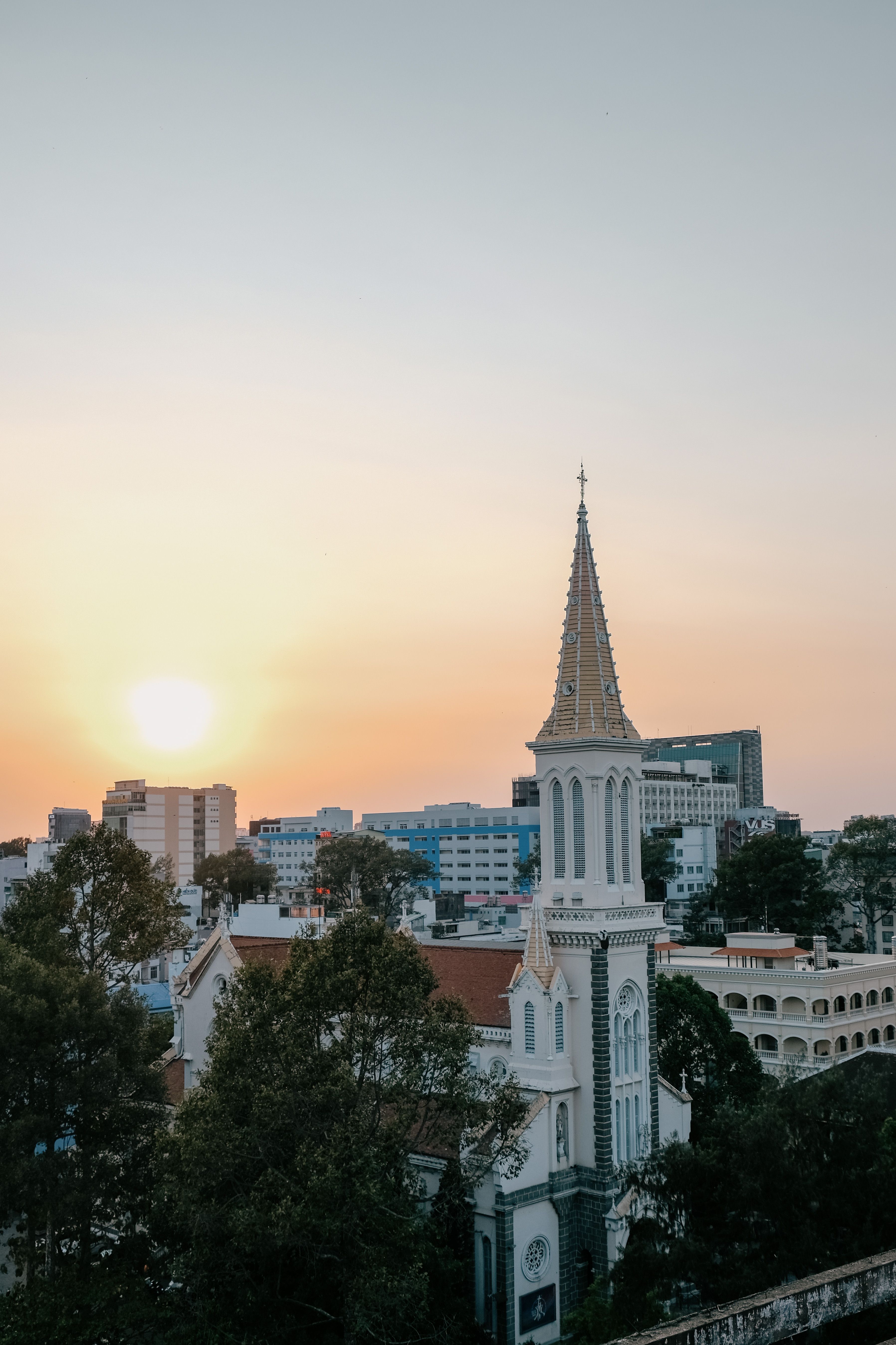 Captivating view of Huyen Si Church in Ho Chi Minh City with sunrise in the background.