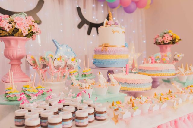 Birthday cake with lit candles on a styled table