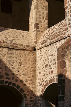 Close-up view of Saint Augustine Monastery's stone walls in Acolman, Mexico.