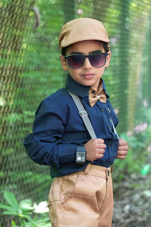 Child Model Posing in Bow Tie and Suspenders