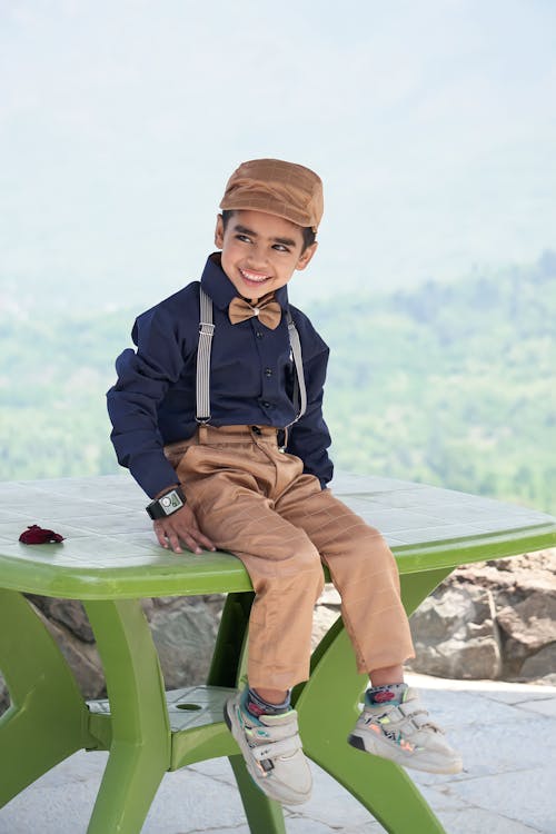 Smiling Child Model in Elegant Shirt and Pants