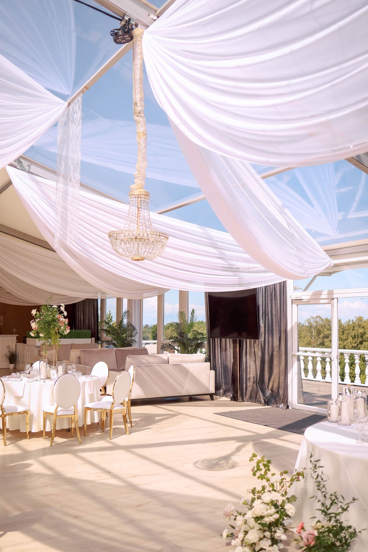 Ivory ceiling drape with warm uplighting
