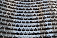 A building with many windows and a large metal structure