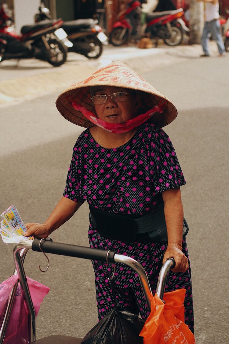 Elderly Woman With Walker On Street