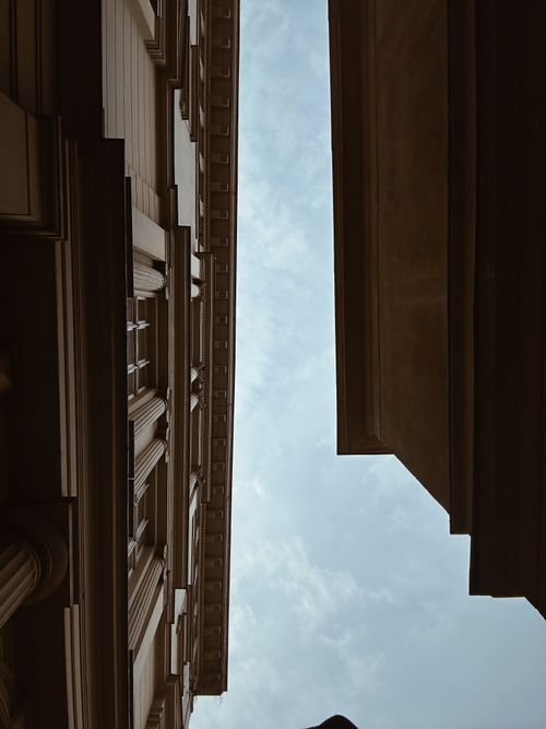 Free Upward view of Berlin's historic buildings against a clear sky, emphasizing urban architecture. Stock Photo