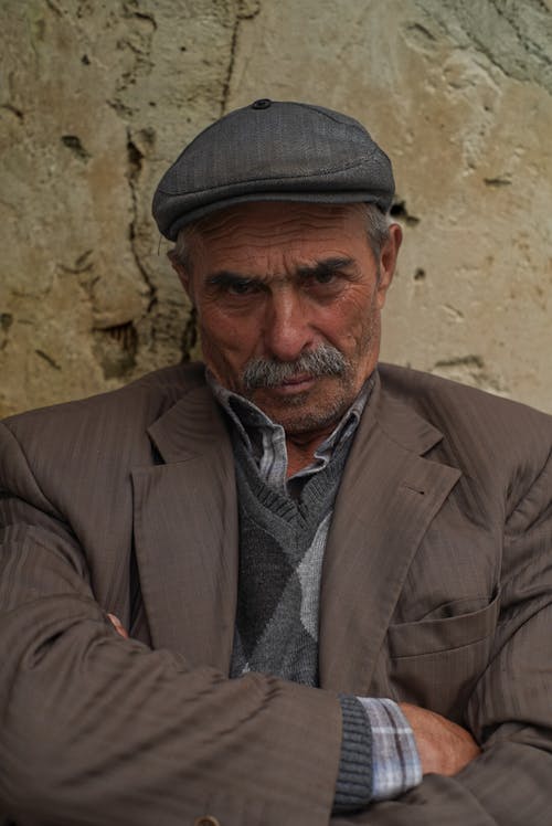 Elderly Man Wearing a Cap 