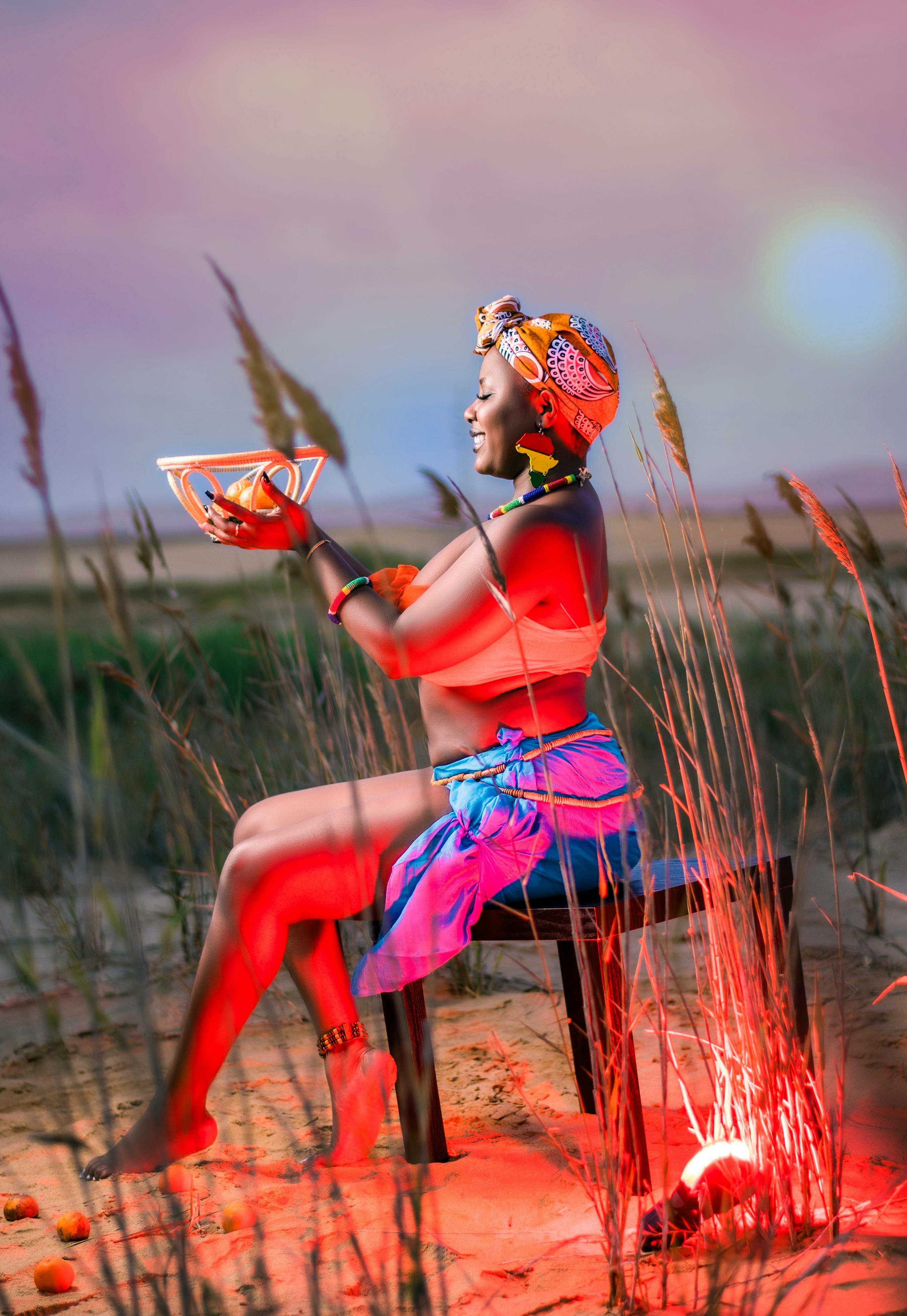 Free Woman in Seaside Wearing Headscarf Bra and Sarong Stock Photo