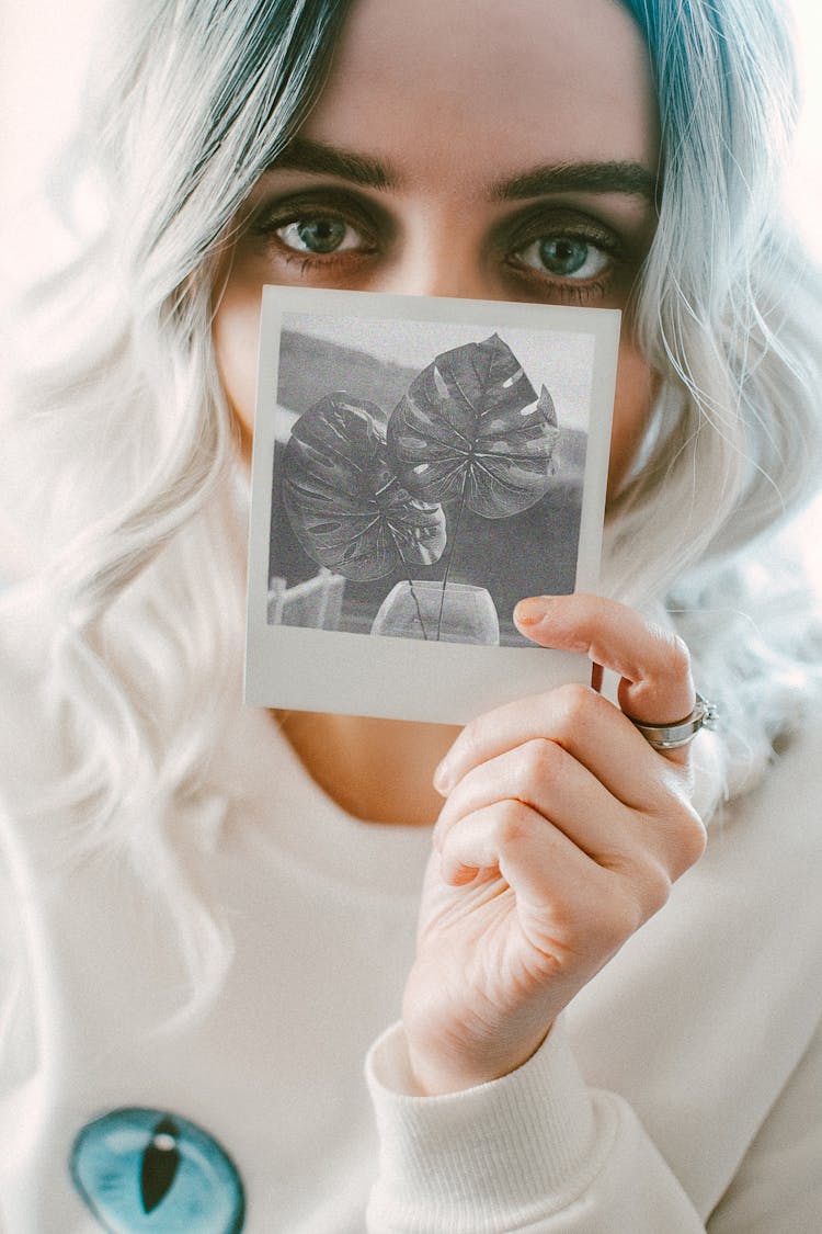 Woman Holding Photo Of Leaves