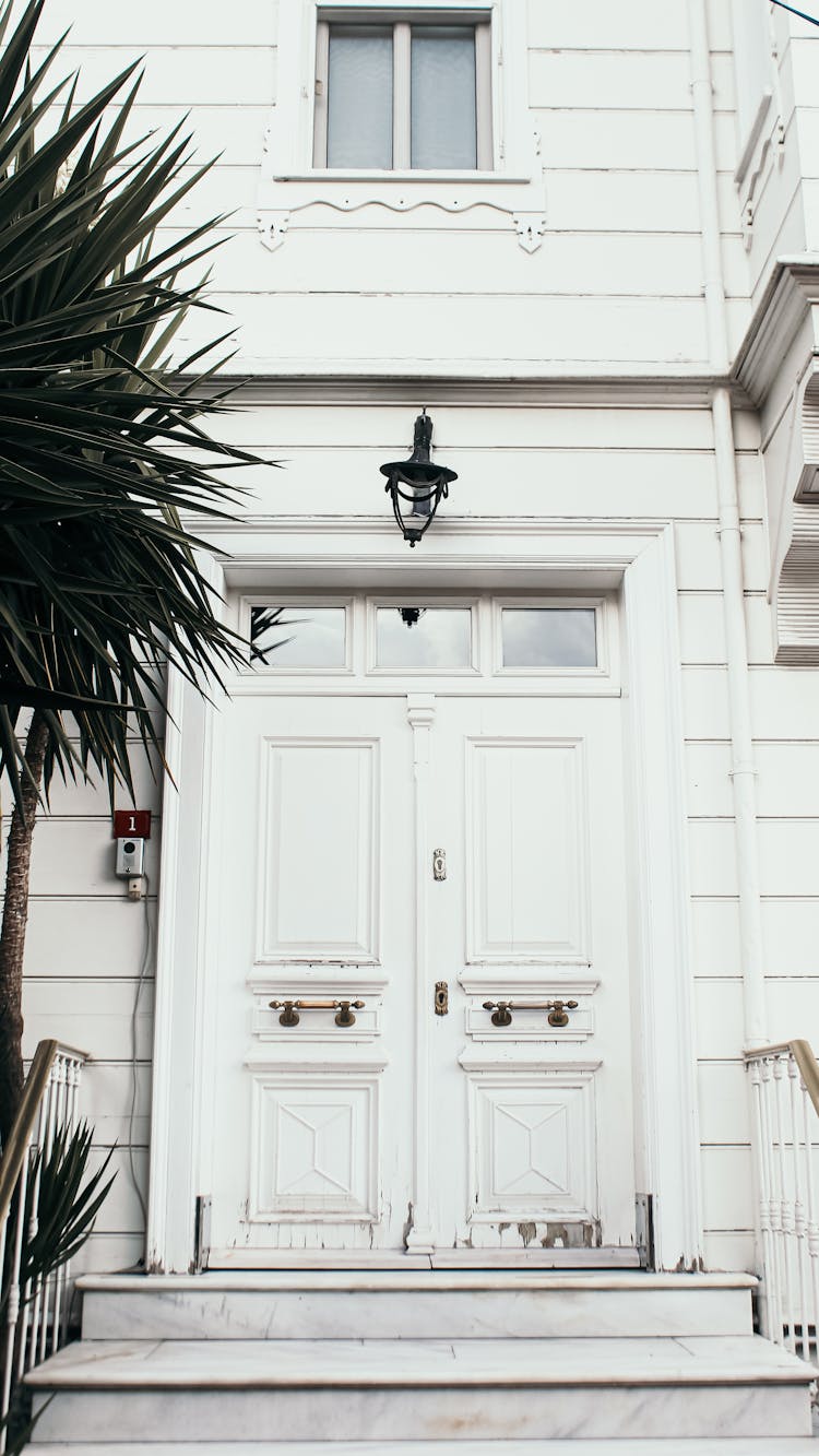 White Door On White Wooden House