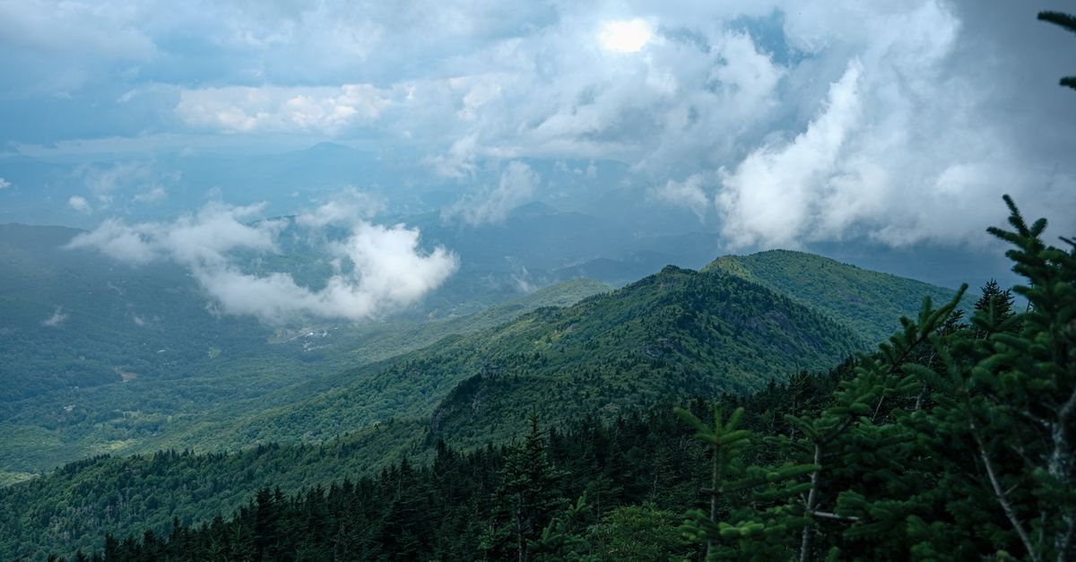 Breathtaking view of the lush mountainous landscape under a cloudy sky in Grandfather, NC.