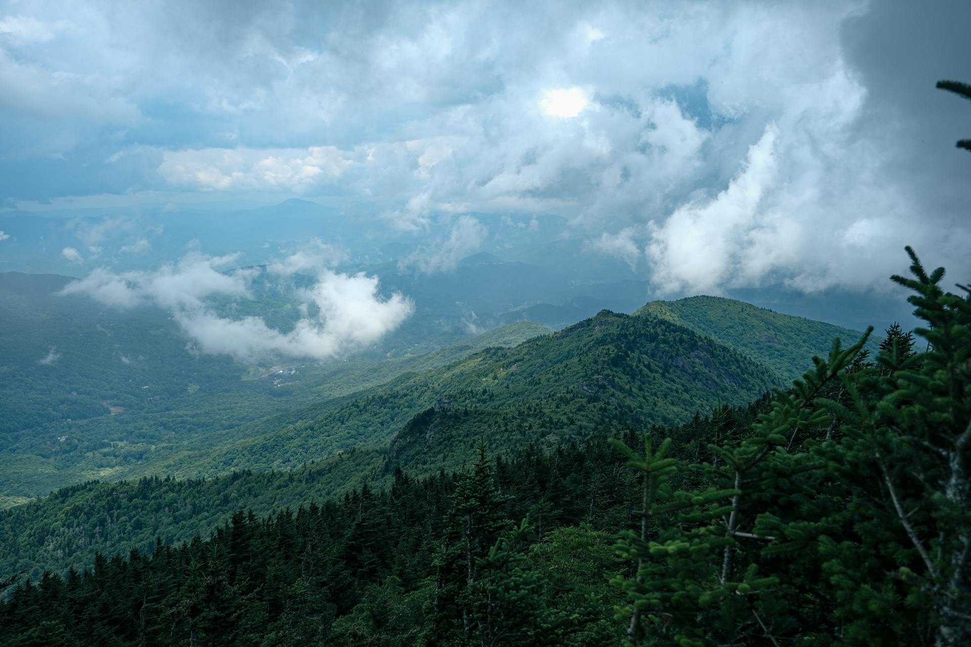 Breathtaking view of the lush mountainous landscape under a cloudy sky in Grandfather, NC.