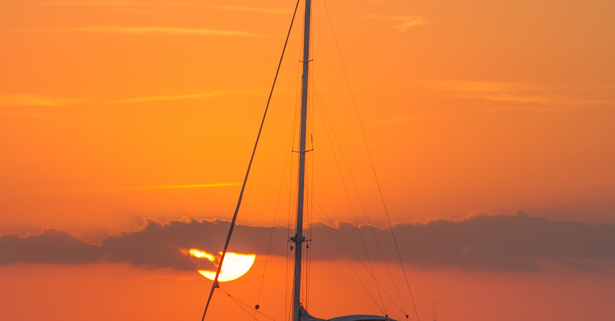 Sailboat on Body of Water during Sunset