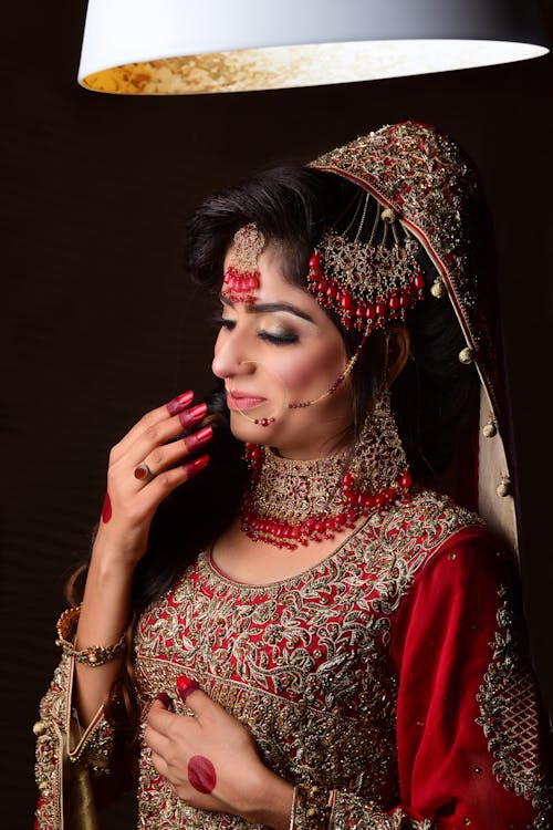 Woman in Traditional Clothing and with Golden Jewelry