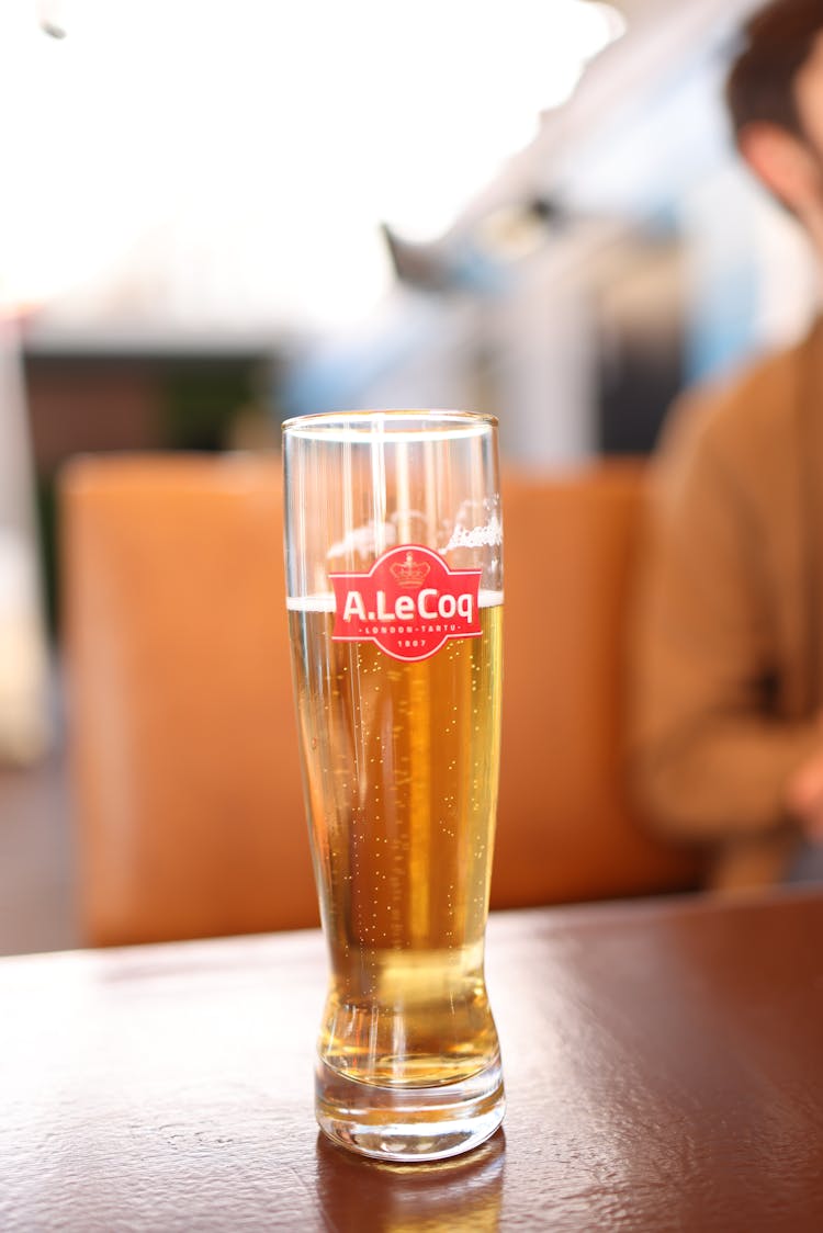 Beer In Tall Glass On Restaurant Table