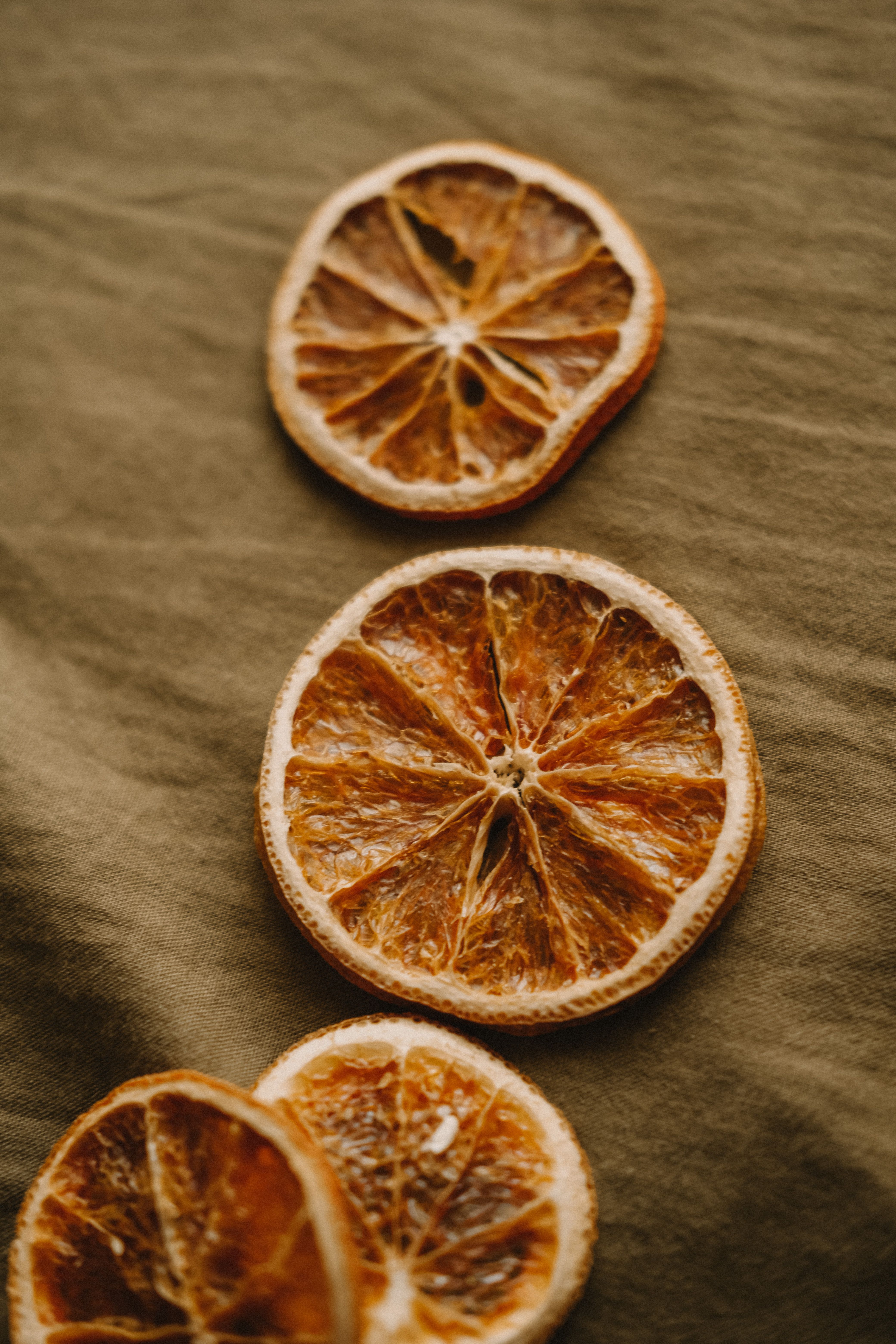 Dehydrated orange slices on natural fabric
