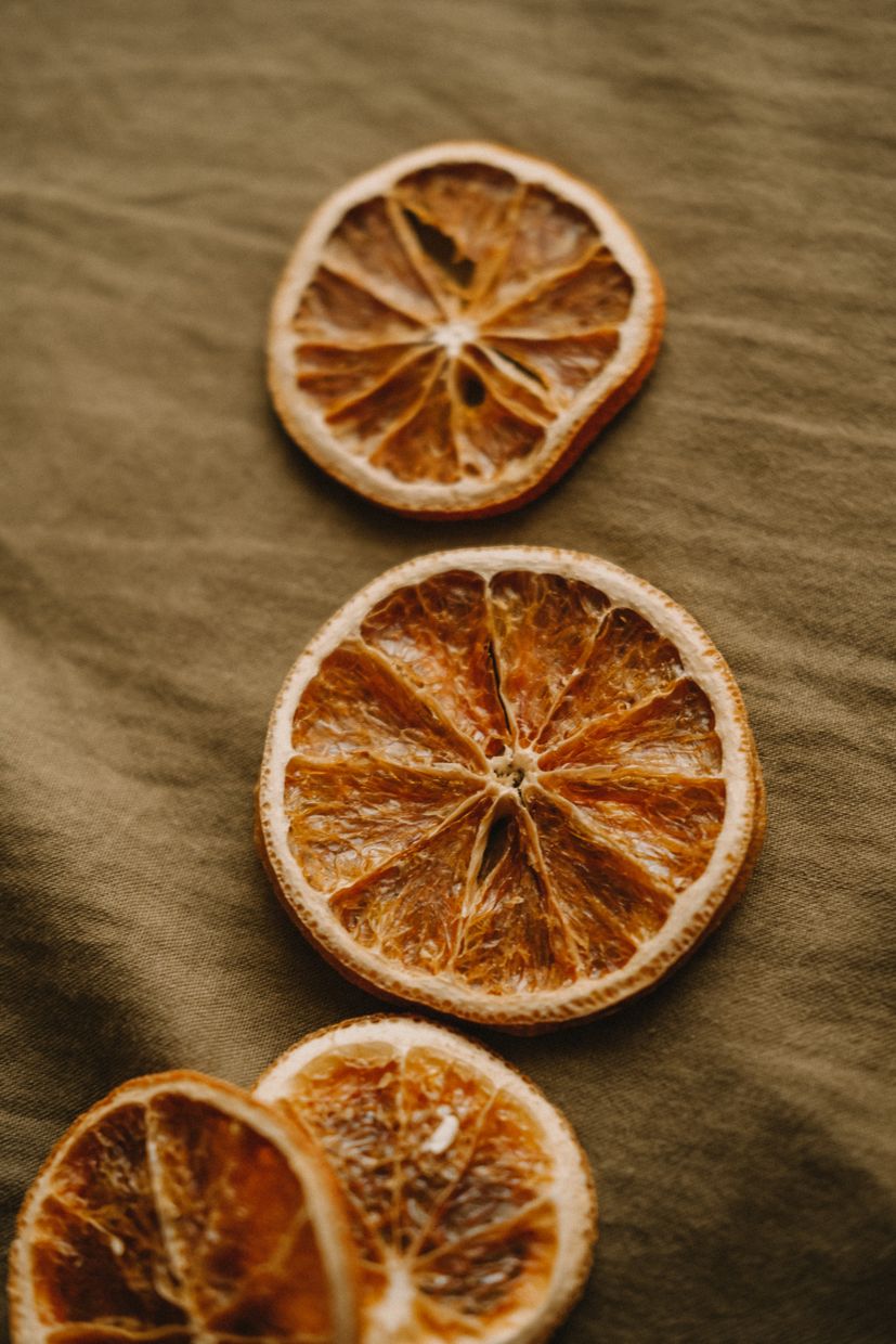 Dehydrated orange slices on natural fabric