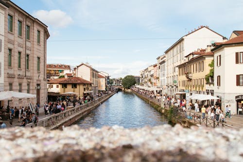 People Walking Beside River