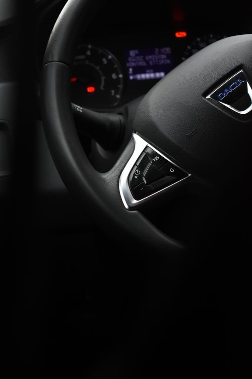 Free Detailed view of a Dacia car steering wheel, showcasing interior design and logo. Stock Photo