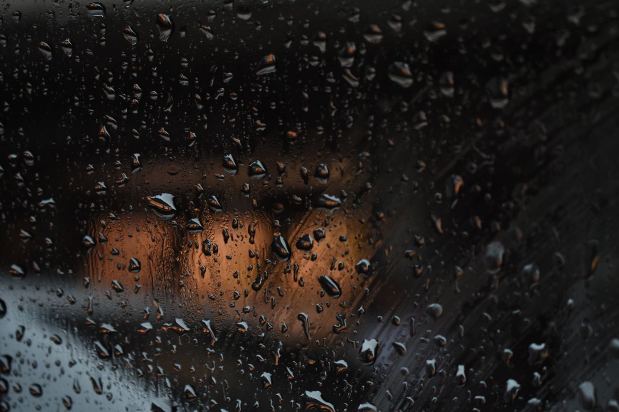 Rain droplets on a car window at night