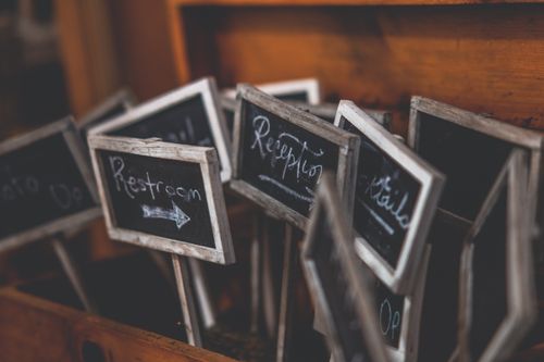 Free Rustic collection of small chalkboard signs used for event directions and labeling. Stock Photo