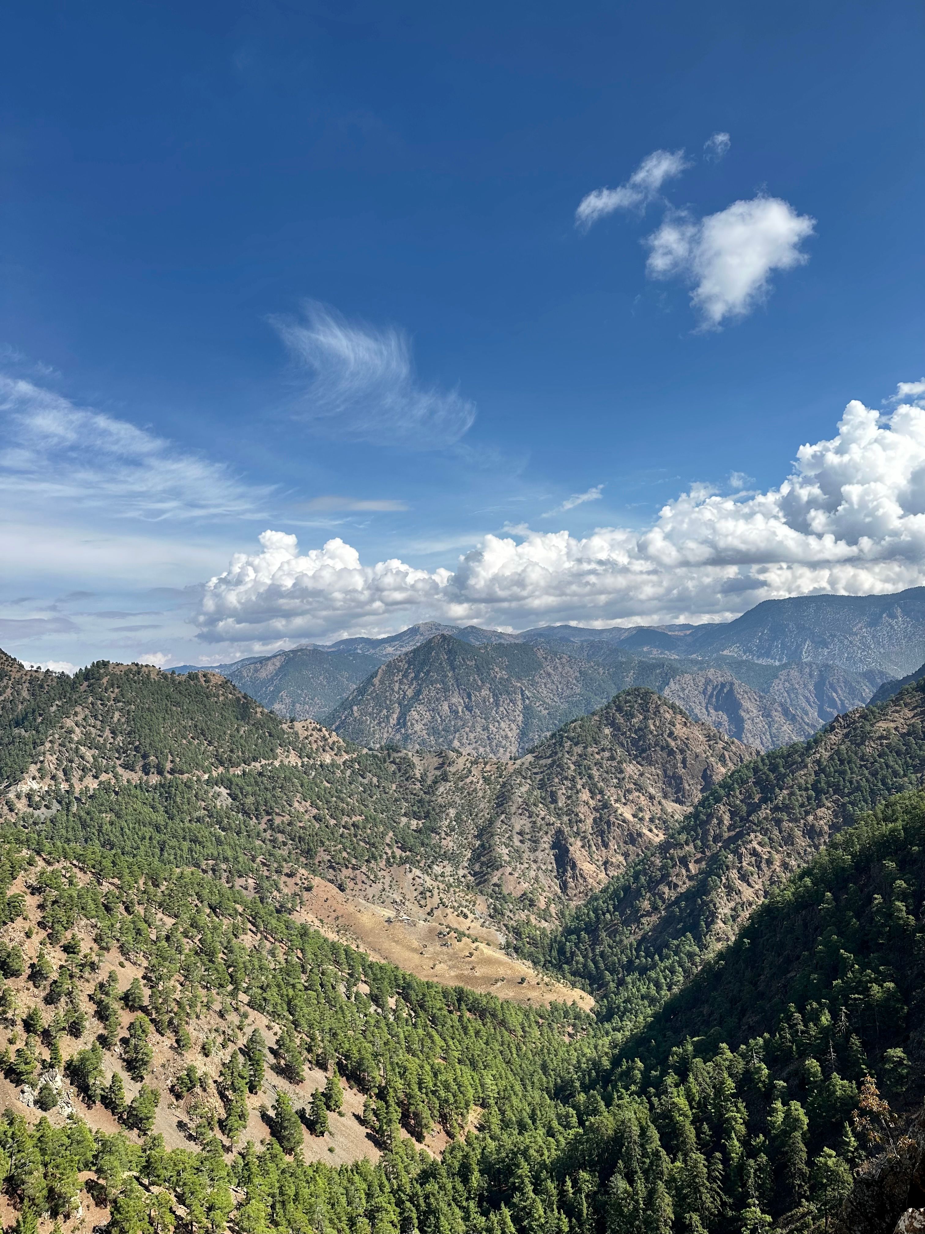 Fluffy White Clouds over Mountain Landscape · Free Stock Photo