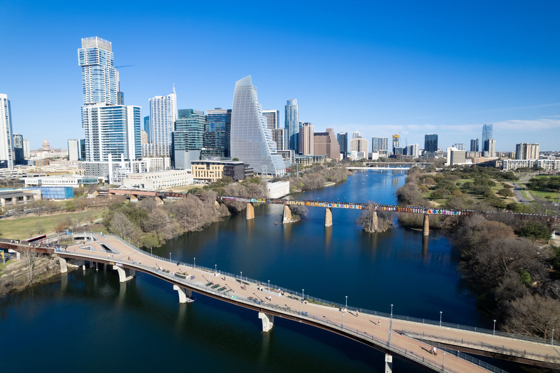 Historic Congress Avenue in Austin with cyclists, food trucks, and warm evening streetlights