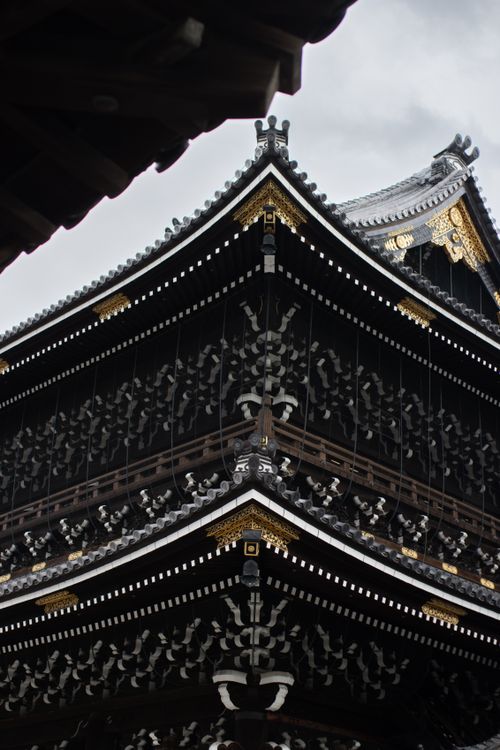 Free Intricate architectural details of Higashi Hongan-Ji Temple in Kyoto, showcasing traditional design and ornate elements. Stock Photo