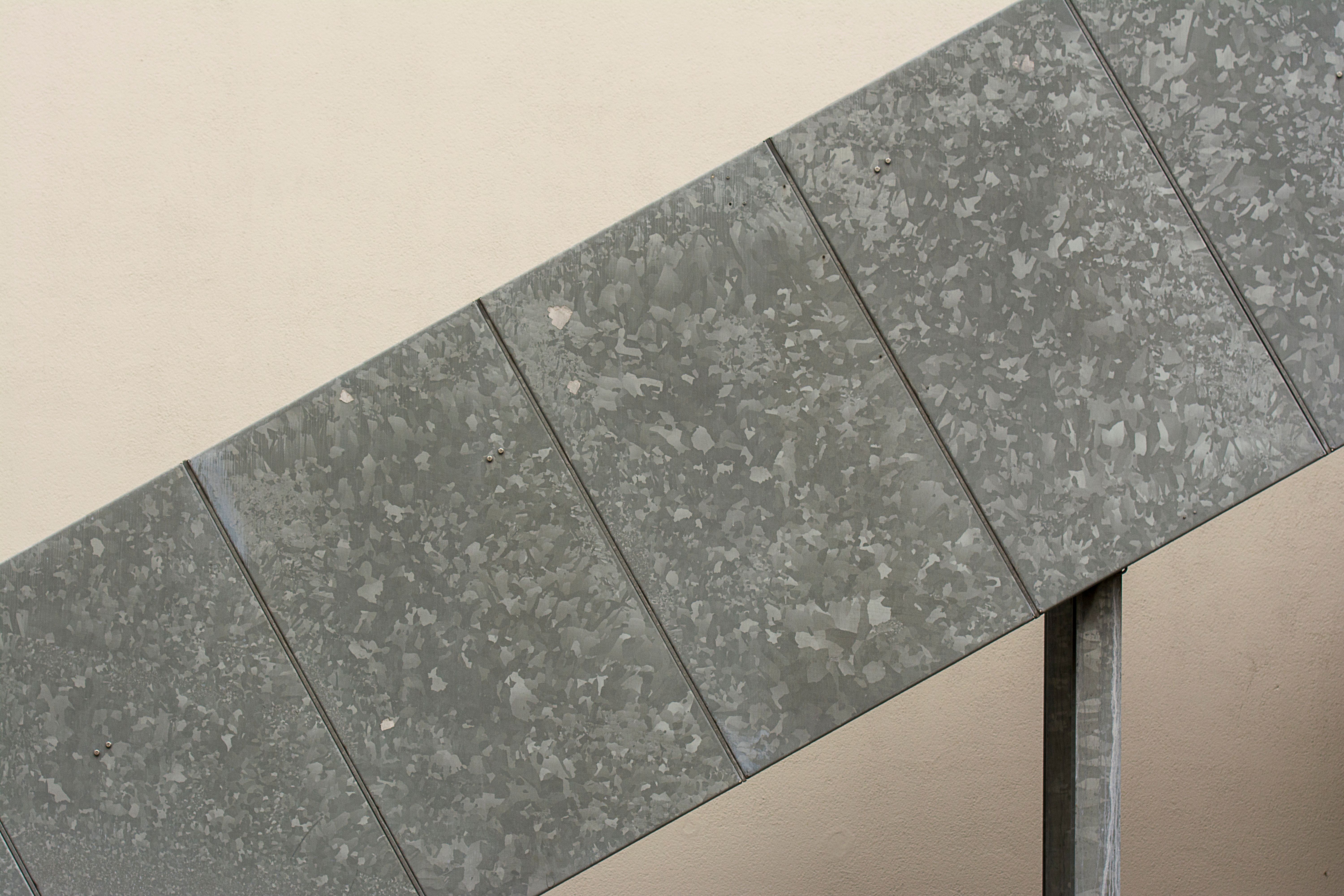 Close-up of a stair-step crack running diagonally across drywall above a doorway illustrating foundation movement damage