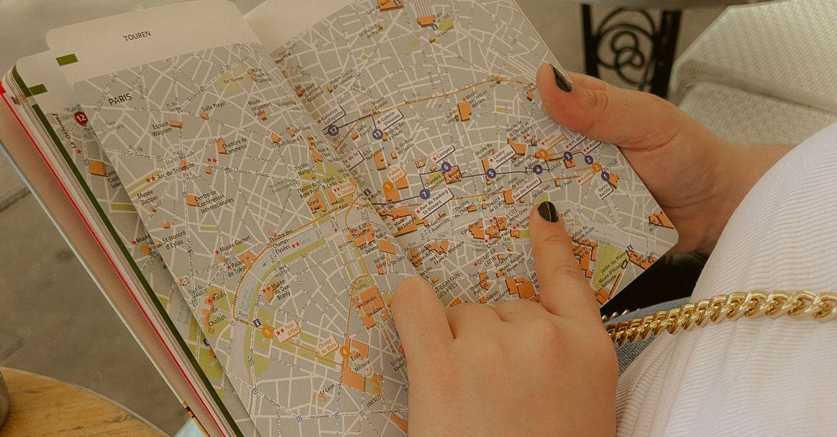 Female Map Reading Woman Reading a Map · Free Stock Photo