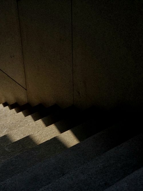 Free Explore the interplay of light and shadows on a concrete staircase for a minimalist aesthetic. Stock Photo