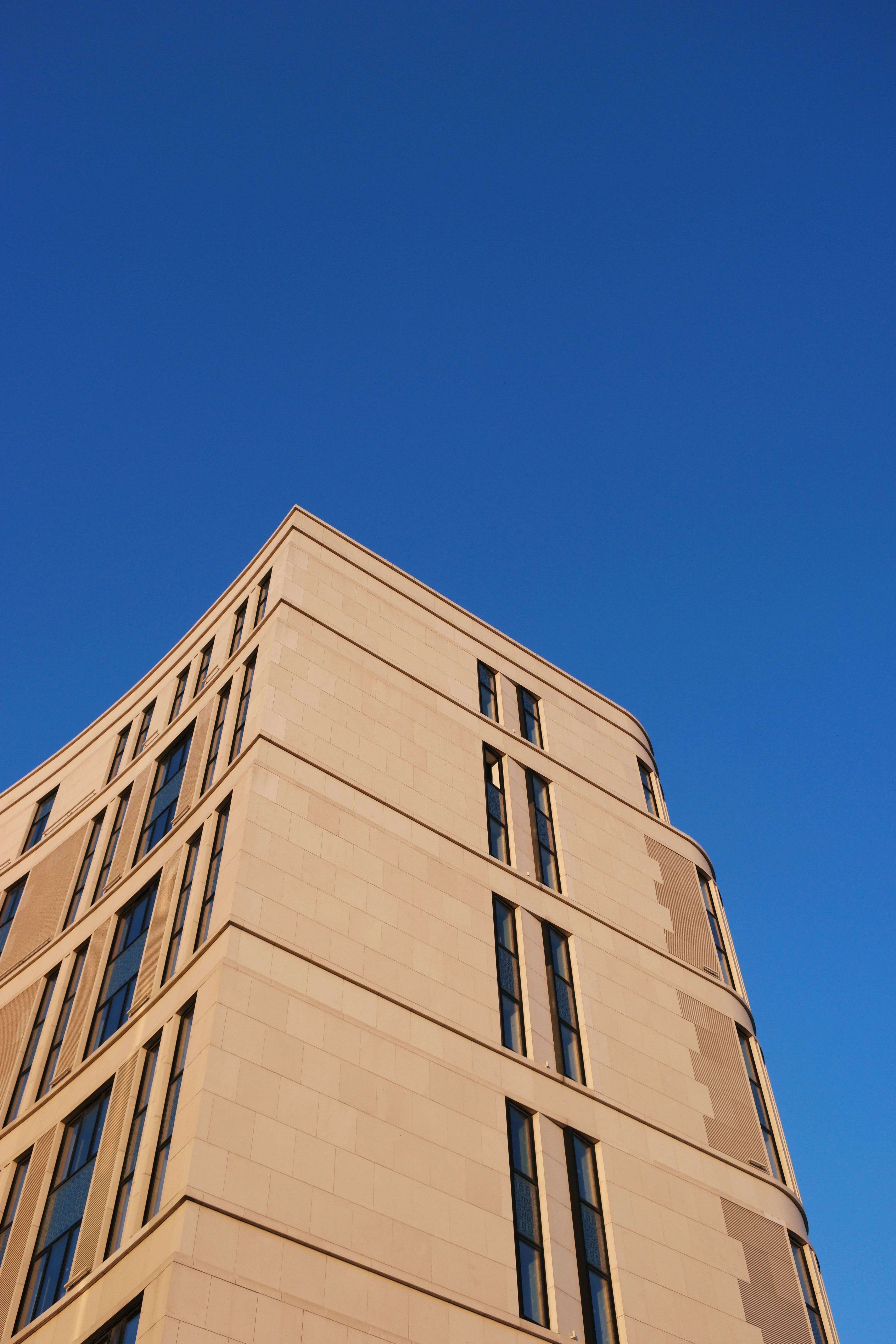 Residential Building against Blue Sky · Free Stock Photo