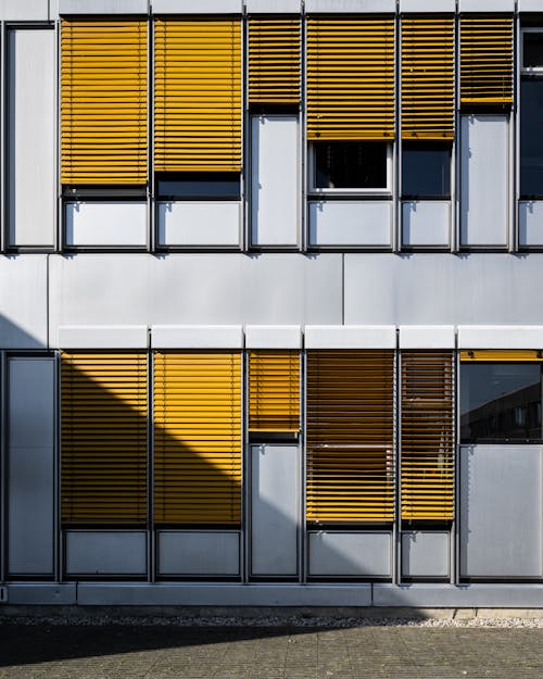 Yellow Roller Blinds on a Building 