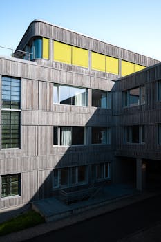 Contemporary school architecture with unique window design in urban Berlin.