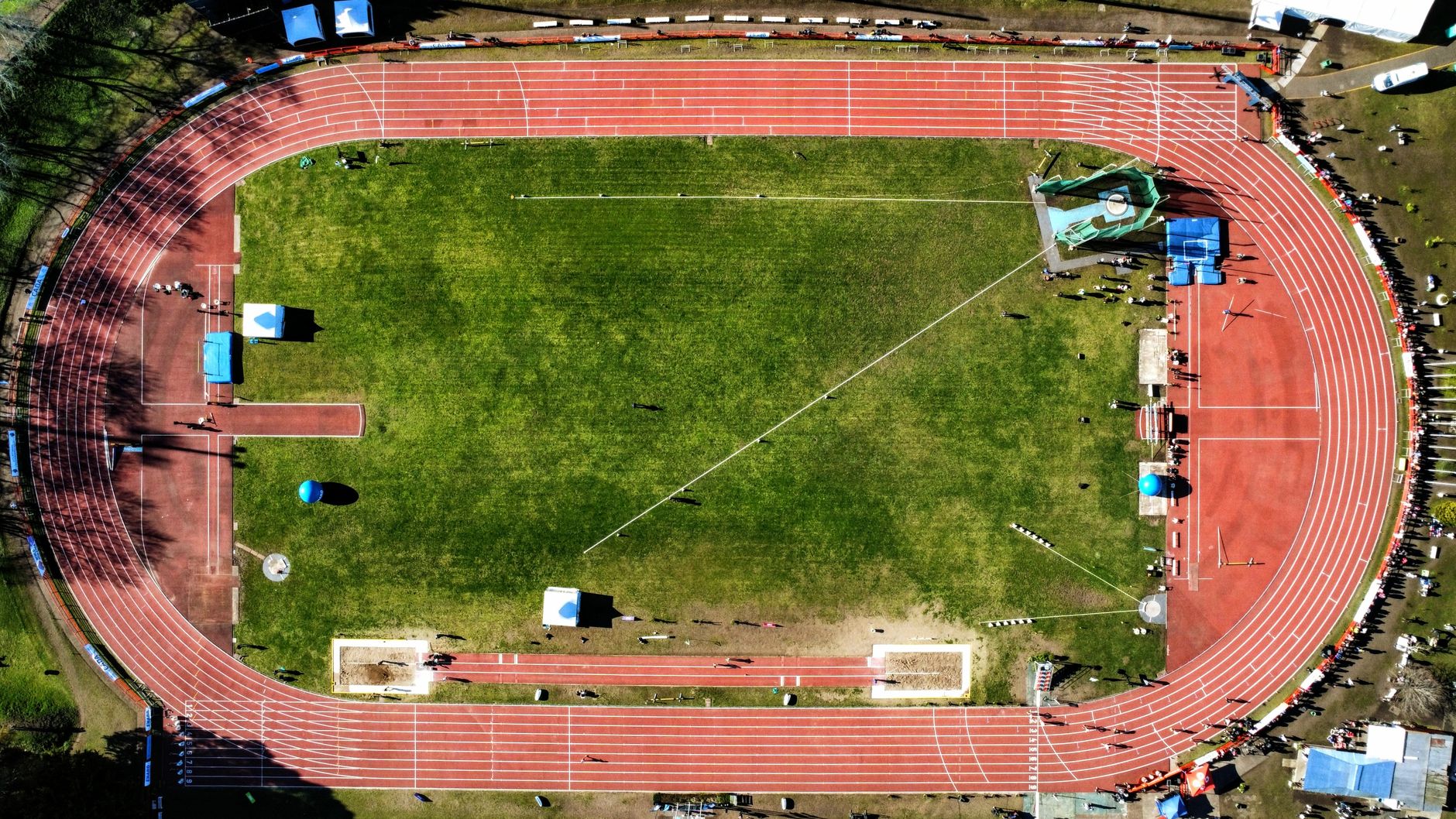 stadium tracking cameras following players and a match ball during a high-speed attacking move