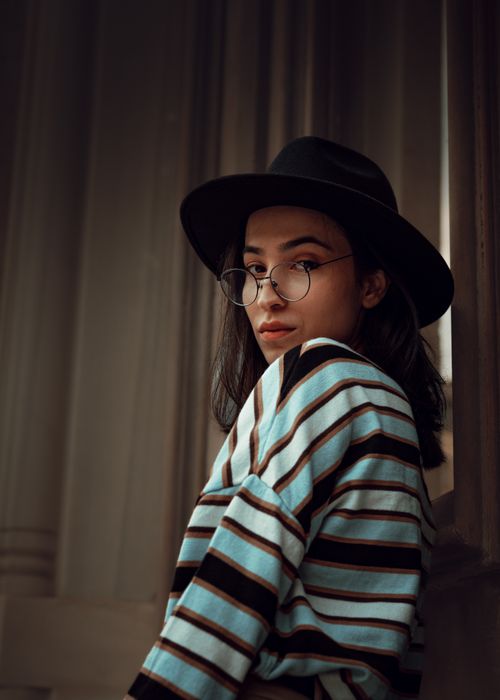 Free Portrait of a woman wearing a hat and glasses in a chic style, Istanbul Stock Photo