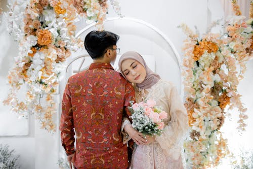 Newlywed Couple in Traditional Clothing 