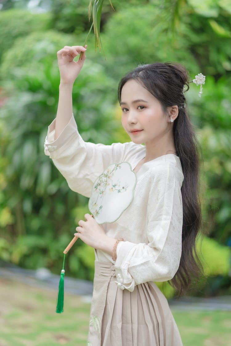 Young Asian Woman Posing In Summer Park